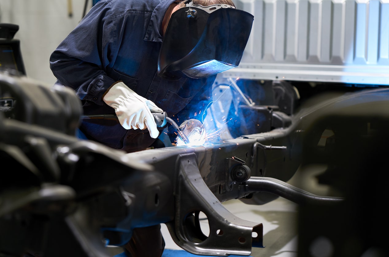 GM Technician Welding a Car Part