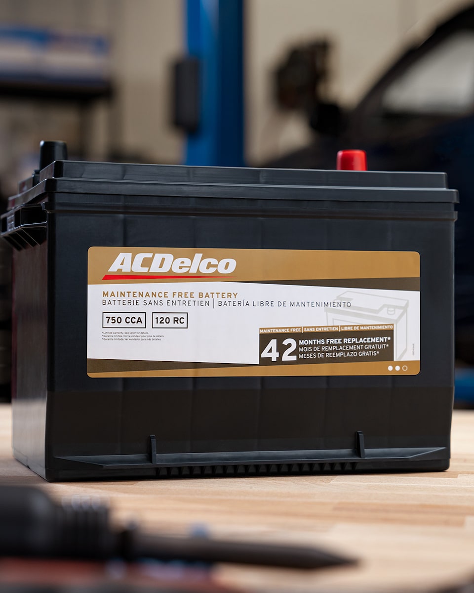 An ACDelco Gold Battery Lying on a Work Bench