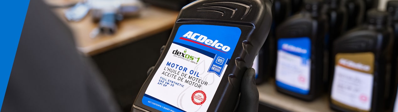 gmp-technician-holding-acdelco-dexos1-motor-oil