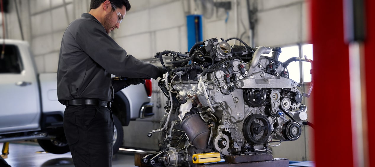 GM Technician Inspecting an Engine