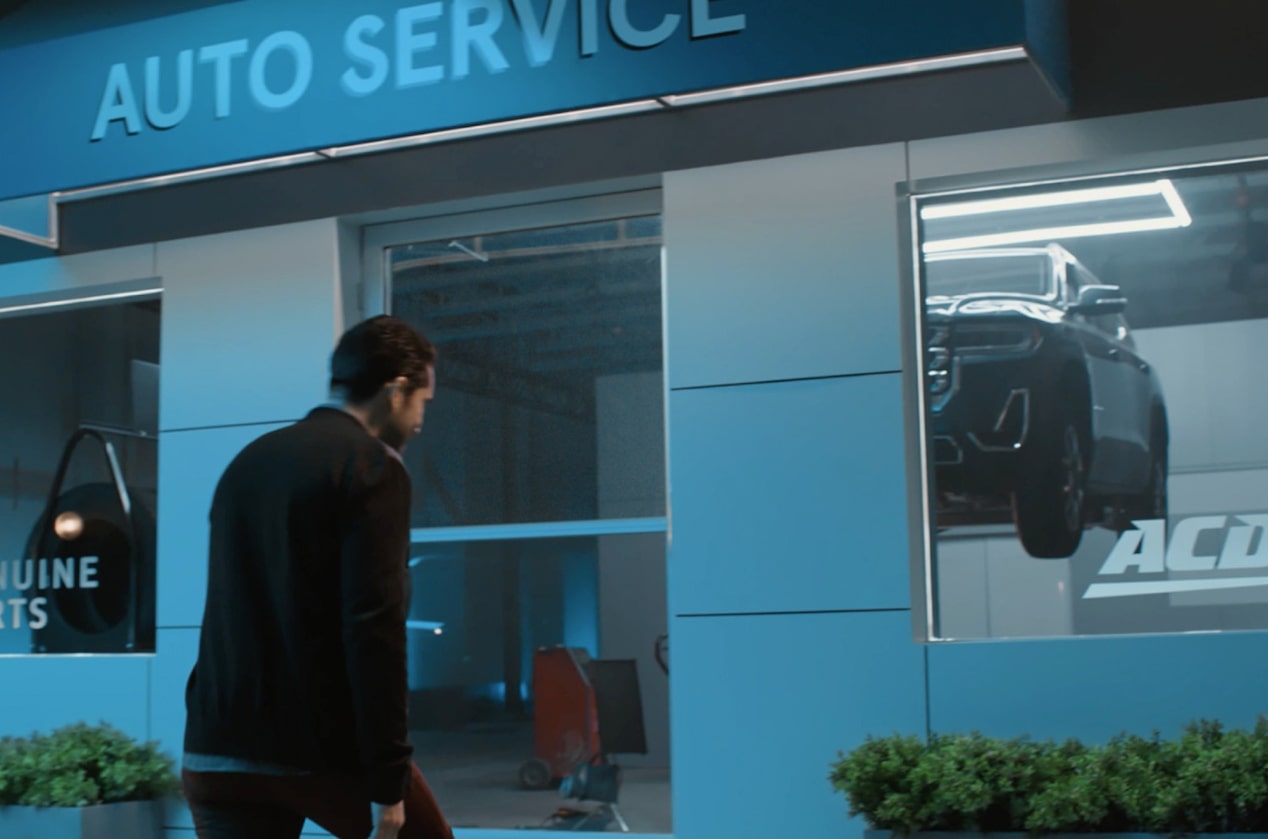 A Man Walking into an Auto Service Building